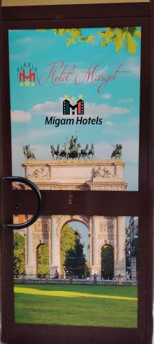 a window with a picture of the michigan hotel at Hotel Margot in Milan