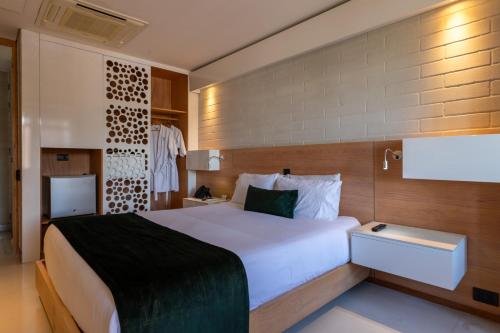 a bedroom with a large bed in a room at Terra Biohotel in Medellín