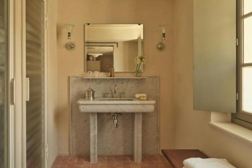 a bathroom with a sink and a mirror at Hôtel du Couvent, a Luxury Collection Hotel, Nice in Nice