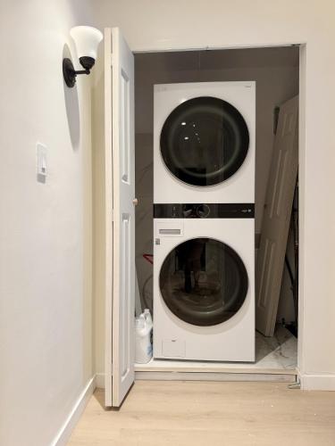 a washer and dryer in a room at Cypress Suites - Stylish apartments in Newburgh IN in Newburgh