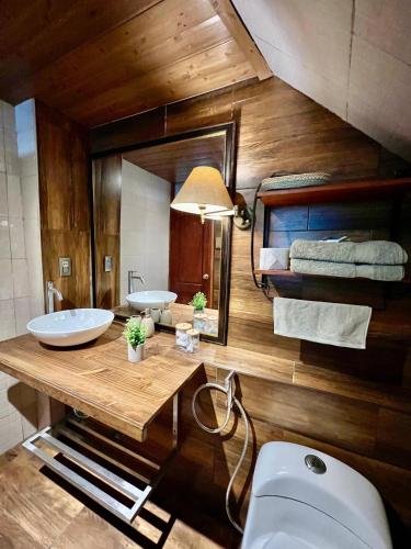 a bathroom with two sinks and a toilet at Apartamento Céntrico in Cusco