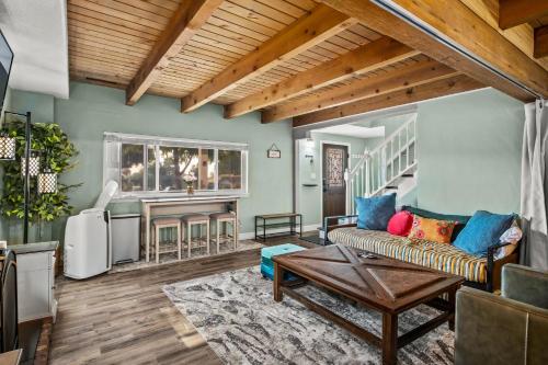 a living room with a couch and a table at MtnCity Views 4BR Firepit FamilyRetreat NearUNR in Reno