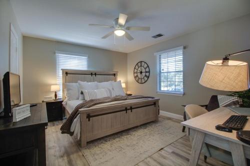 a bedroom with a large bed with a ceiling fan at Low Country Get Away 3 bed 2 bath Home in Bluffton