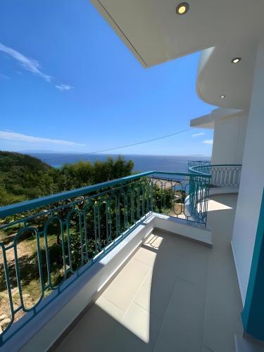 a balcony with a view of the ocean at Endless blue Apartments in Dhërmi
