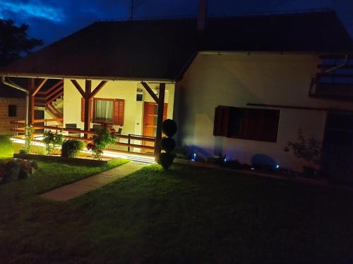 a house with a lit up yard at night at Kuća za odmor Ria in Gornja Voća