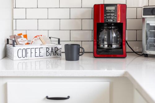 a coffee bar on a counter next to a microwave at Pleasant Valley Resort in Arcadia
