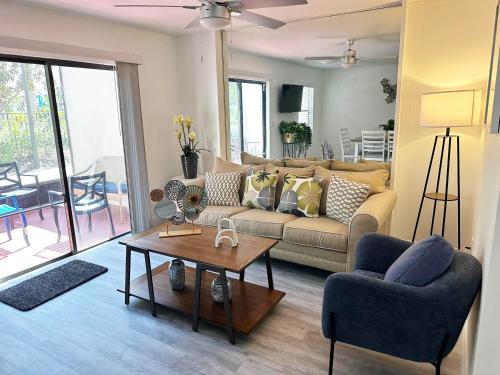 a living room with a couch and a table at Family vacation Villa in Fantasy World Resort - Minutes from Disney in Kissimmee