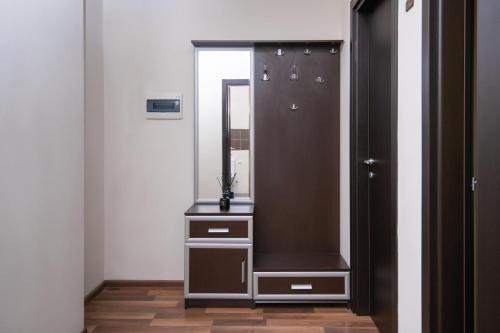 a dressing room with a mirror and a dresser at Cozy stay rentals- cozy & sweet 1 BR apartment in Tbilisi with city & mountains view in Tbilisi City