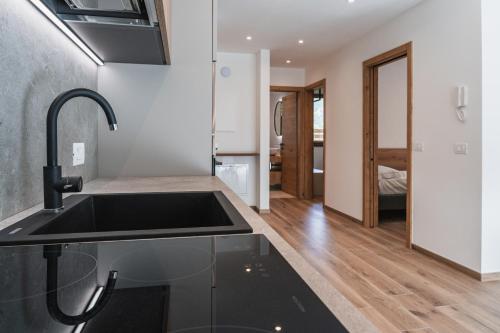 a kitchen with a sink and a counter top at Casa Stefania 3 in Pieve Di Ledro