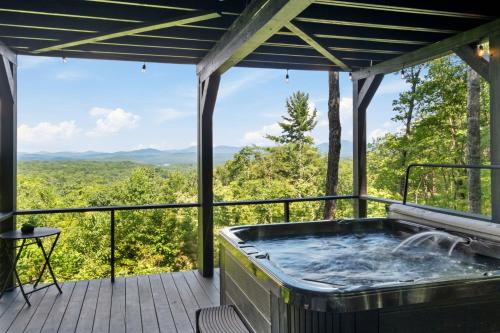 a hot tub on a deck with a view at Top of the Mountain Breathtaking Views Hot Tub in Blue Ridge
