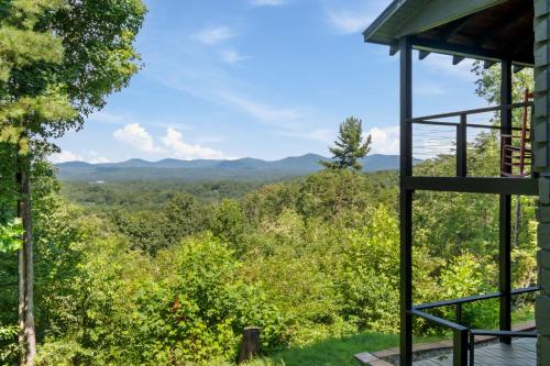 a view of the mountains from the porch of a house at Top of the Mountain Breathtaking Views Hot Tub in Blue Ridge