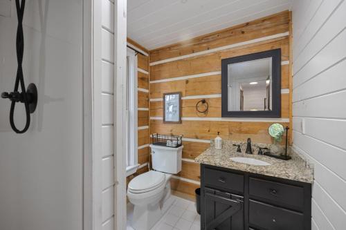 a bathroom with a toilet and a sink at Top of the Mountain Breathtaking Views Hot Tub in Blue Ridge