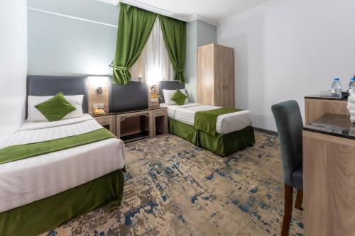Katil atau katil-katil dalam bilik di Hayah Diamond Hotel