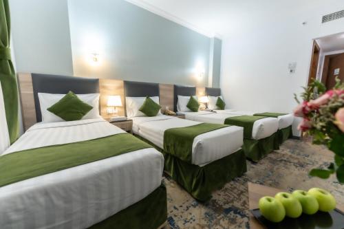 Katil atau katil-katil dalam bilik di Hayah Diamond Hotel