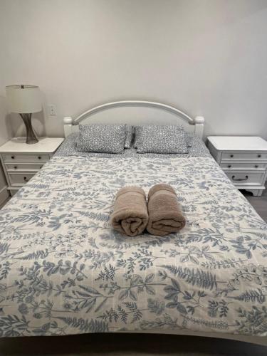 a bedroom with a bed with towels on it at Angie house in Nanaimo