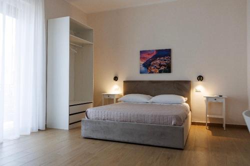 a bedroom with a bed in a room at Maison Marechiara in Castellammare di Stabia