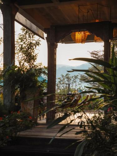a view from the porch of a house at Proud Phu Fah Maerim Resort in Mae Rim