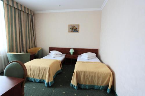 Postel nebo postele na pokoji v ubytování Hotel Mars