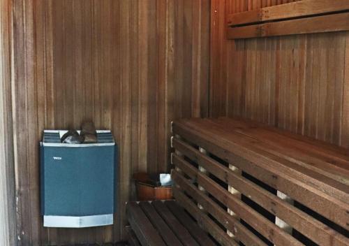 a wooden room with a bench and a cpu at Grand Palace Hotel in Miri