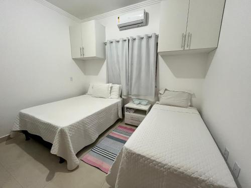 En eller flere senge i et værelse på Casa Oliveira - Residencial Caminho da Praia