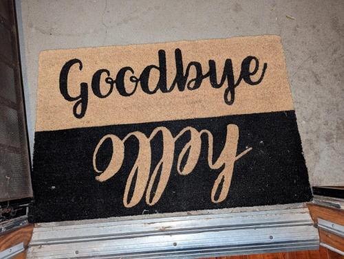 a sign that says goodbye cry sitting on top of books at STADIUM LUXURY - CONDO for 4 STEPS AWAY FROM SOFI in Inglewood