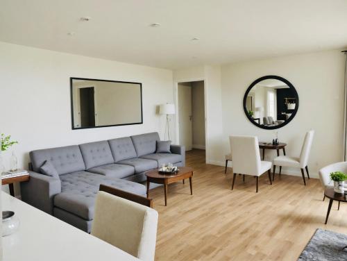 a living room with a couch and a table at Hollywood Boutique Residences with Free Parking in Los Angeles