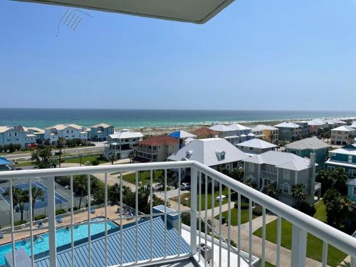 a view of the beach from the balcony of a resort at 1 Bedroom Condo with Amazing View in Pensacola Beach