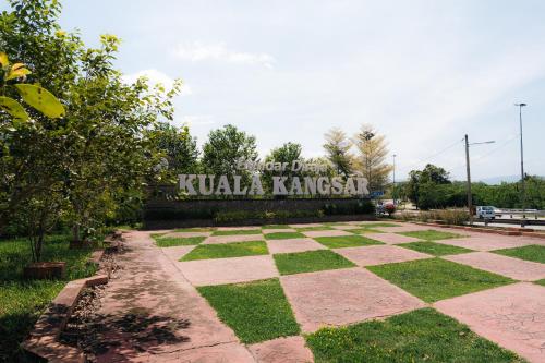 a sign that says kula kombat in a park at Villa Cinta Jasmeen in Kuala Kangsar