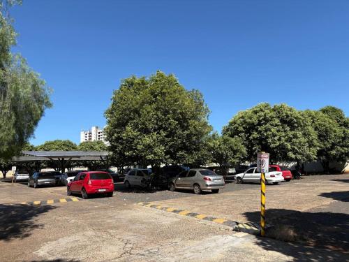 a group of cars parked in a parking lot at Thermas Place Flat in Caldas Novas
