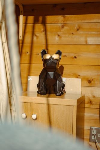 a stuffed animal sitting on top of a table at 箱根 邂逅 ログハウス 森林浴とBbqが楽しめる in Ashinoyu