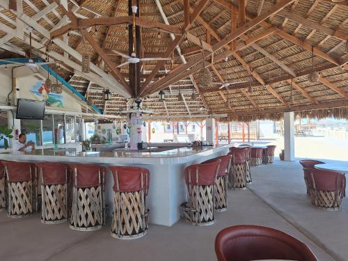 a bar in a restaurant with chairs around it at #55 Suite Bungalow Seaside Hotel & Victors RV Park in San Felipe