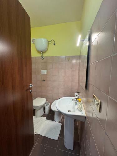 a bathroom with a sink and a toilet at La Marinella in Lamezia Terme