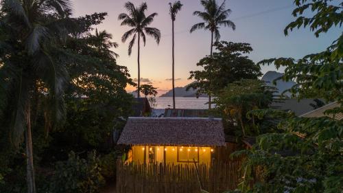 a small house with lights on top of it at La Casita in El Nido