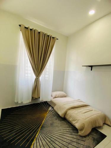 a bedroom with a bed and a window with curtains at ZuLee Homestay in Lunas