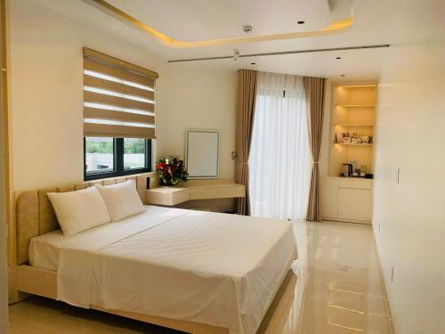 Ένα ή περισσότερα κρεβάτια σε δωμάτιο στο homestay BlueSeavia Vin Vũ Yên - HP432