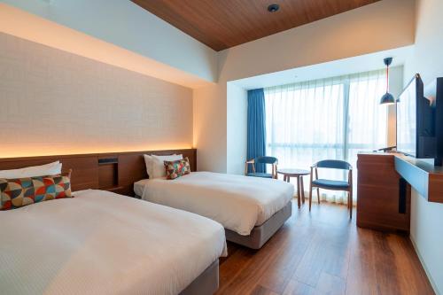 Katil atau katil-katil dalam bilik di La'gent Hotel Okinawa Naha