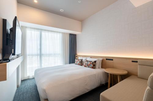 Katil atau katil-katil dalam bilik di La'gent Hotel Okinawa Naha