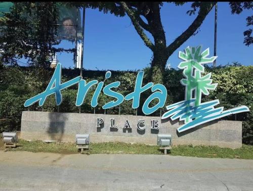 a sign for an ak place in front of a building at Apartment in Parañaque in Manila