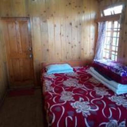 Ένα ή περισσότερα κρεβάτια σε δωμάτιο στο Kabiraj Homestay by StayApart