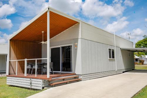 a modular home with a deck and a porch at Ingenia Holidays Townsville in Townsville
