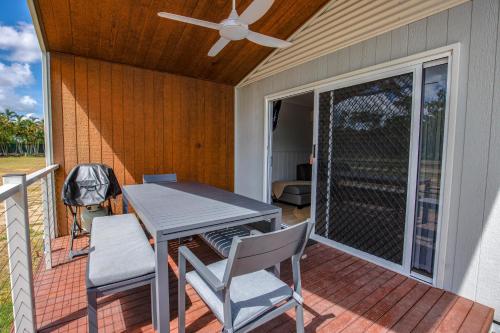 a patio with a table and chairs on a deck at Ingenia Holidays Townsville in Townsville