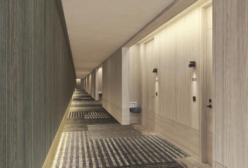a hallway of a building with a long aisle at JW Marriott Hotel Tokyo in Tokyo
