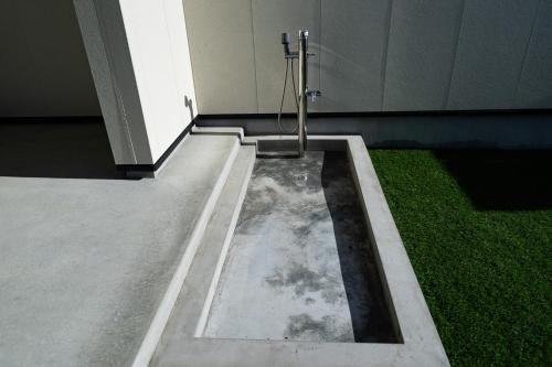 a pool of water in the floor of a building at theView 三浦市晴海町 in Miura