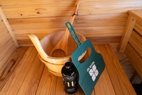 a bottle in a basket on a table at theView 三浦市晴海町 in Miura