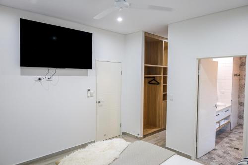 TV o dispositivi per l'intrattenimento presso Aura Luxe Family Stay