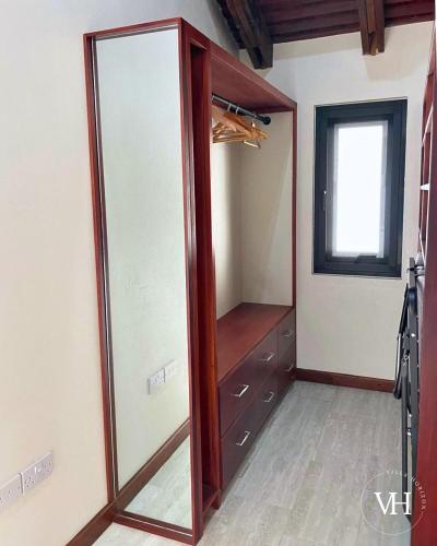a walk in closet with a glass door at The Triplex at Villa Horizon - Three Private Suites in Rodney Bay Village