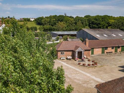 an overhead view of a building with a yard at Shepherd's Cottage in Pett