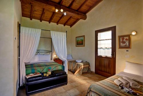 Posteľ alebo postele v izbe v ubytovaní Villa Hotel Valle Del Marta Resort