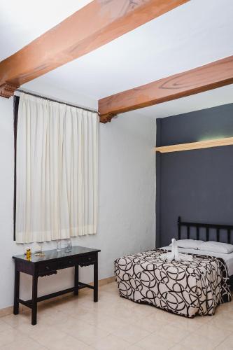 Ein Bett oder Betten in einem Zimmer der Unterkunft Hotel Montejo