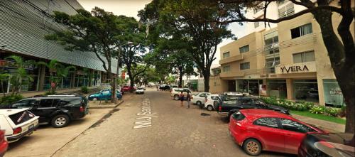 a street with cars parked on the side of the road at 201 - Monoambiente Studio Moderno in Santa Cruz de la Sierra